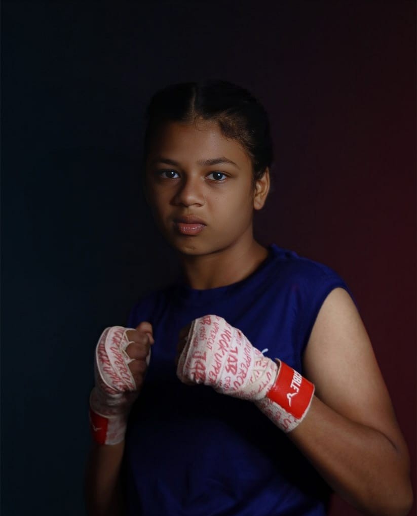 Aarav Singh holding a boxing belt